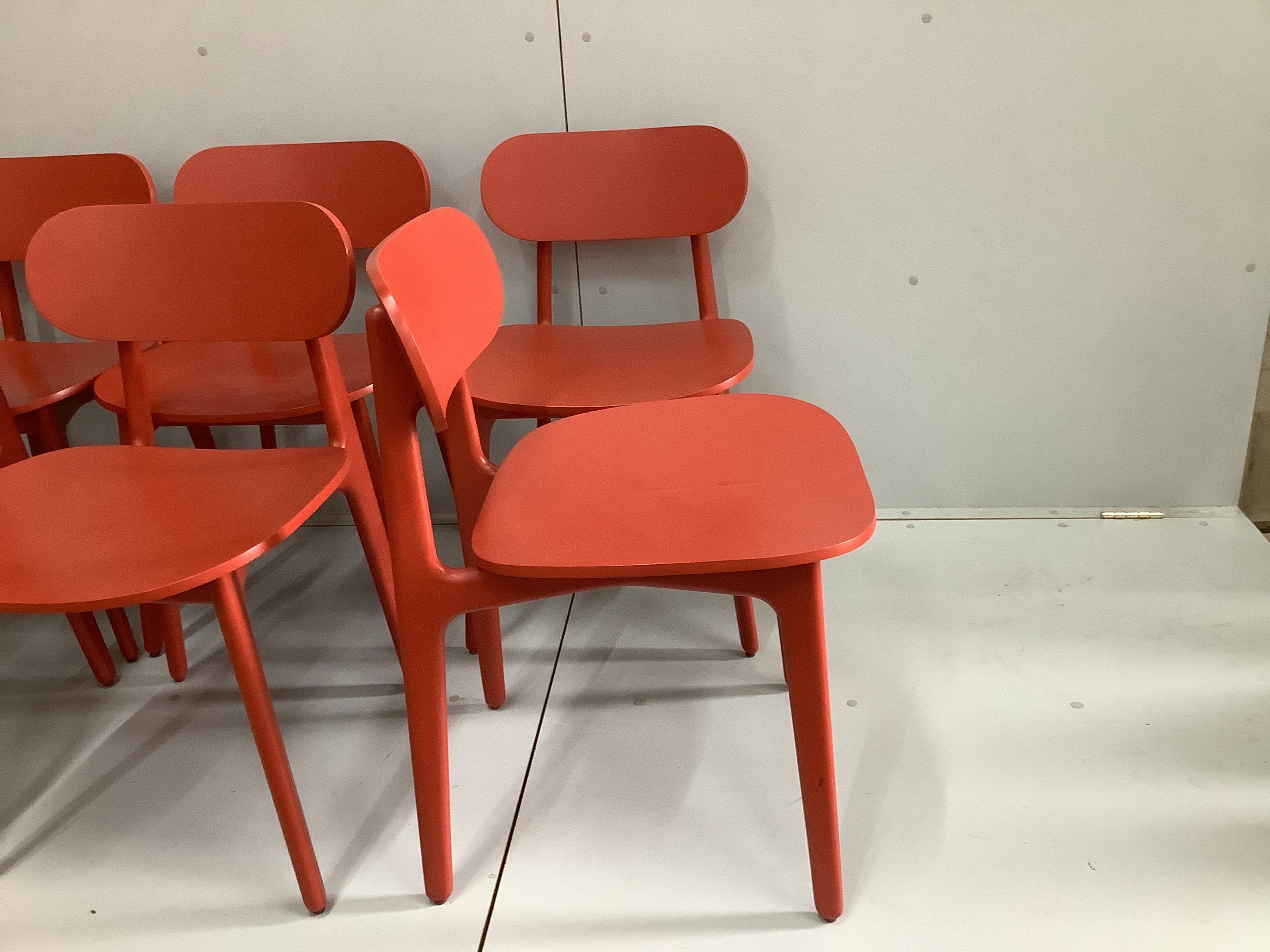 In the manner of Pearson Lloyd, a set of eight PLC type red lacquer oak chairs, width 47cm, depth 50cm, height 75cm